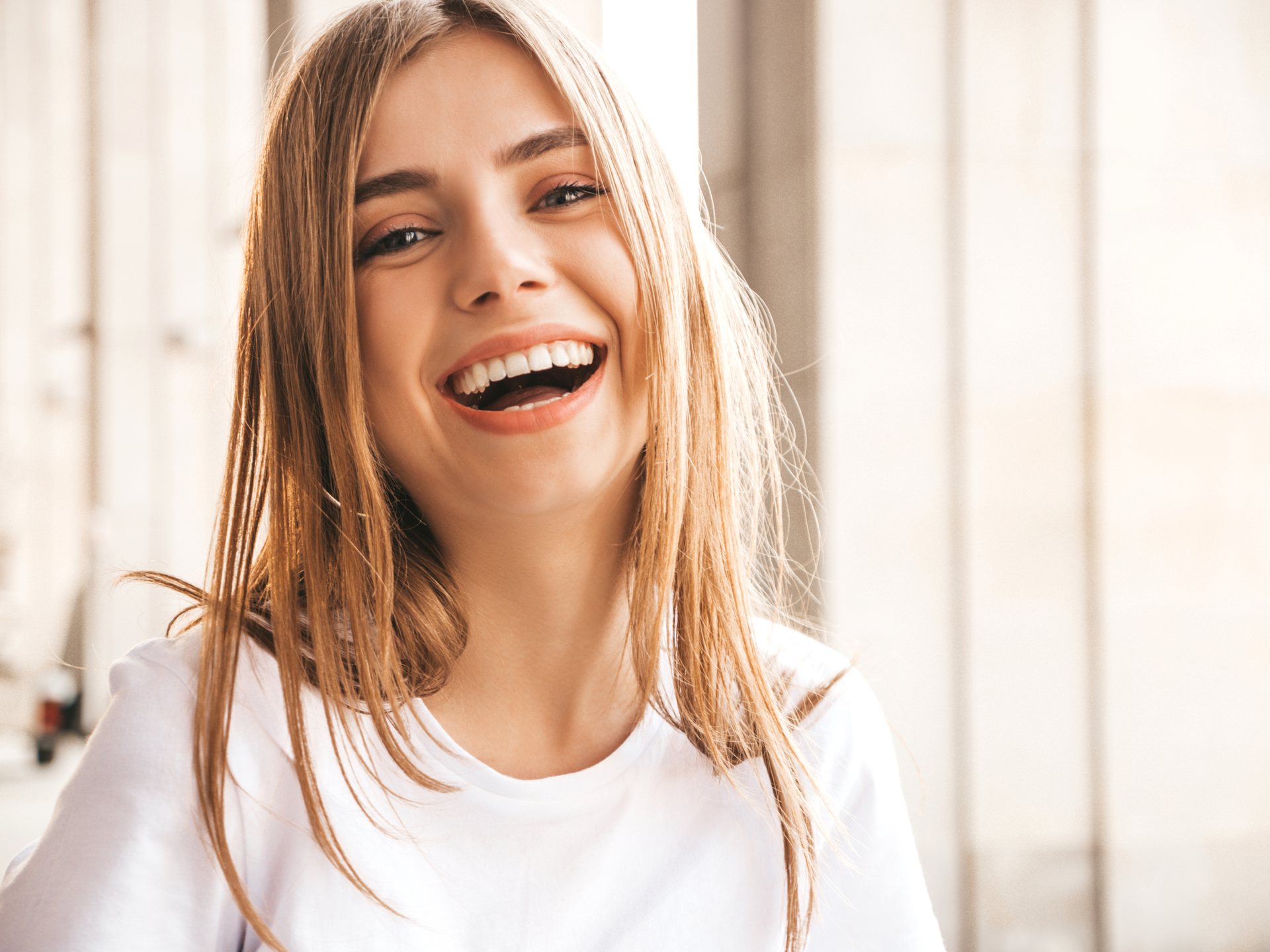 Smiling young woman with glowing skin